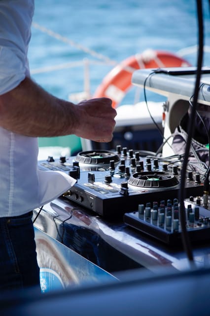 Malaga: Catamaran Sailing Cruise with Swimming & Optional DJ - Front nets, regular seats, and the crowd