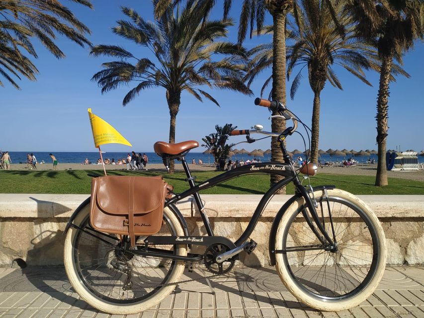 Malaga: Guided Bike Tour - La Farola marks the port entrance