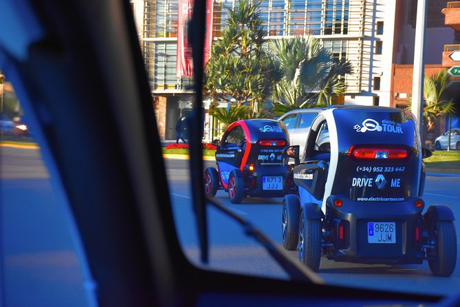 Malaga Highlights by Electric Car with Port Pick up - Returning through the center, including Soho and La Manquita
