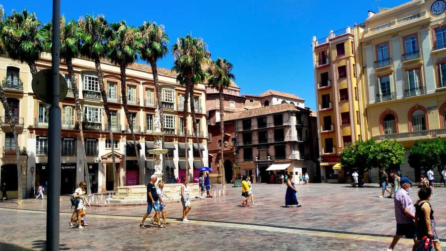 Málaga: Historic Center Tour with Local Guide - Constitution Square shows the city in motion