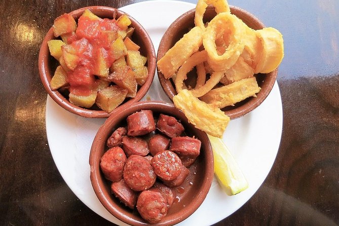 Malaga Market Food Tour: Tapas, Drinks, and Local Flavors - First tasting: octopus or tuna with a small beer