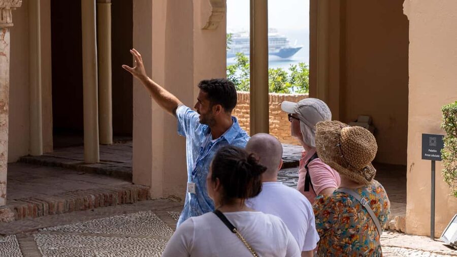 Malaga Walking Tour, Roman Theater and Alcazaba in small group with Tickets - Meeting at Plaza de la Marina and walking up Calle Larios