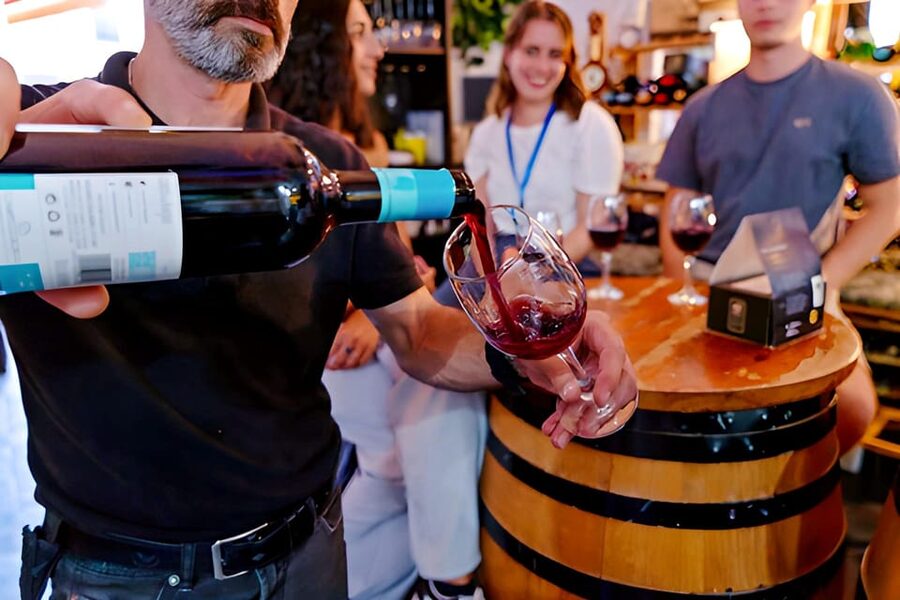 Malaga: Wine and Tapas Tour with Tastings and Drinks - Walking through central Malaga between bites