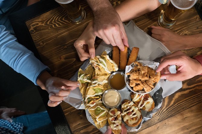 Marbella Food Tour: Tapas, Drinks and Delights with a Local - Plaza de la Victoria and two classic Spanish bites