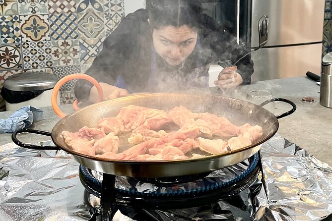 Paella and Sangria Workshop in Malaga - Mixing fresh sangria during the cooking