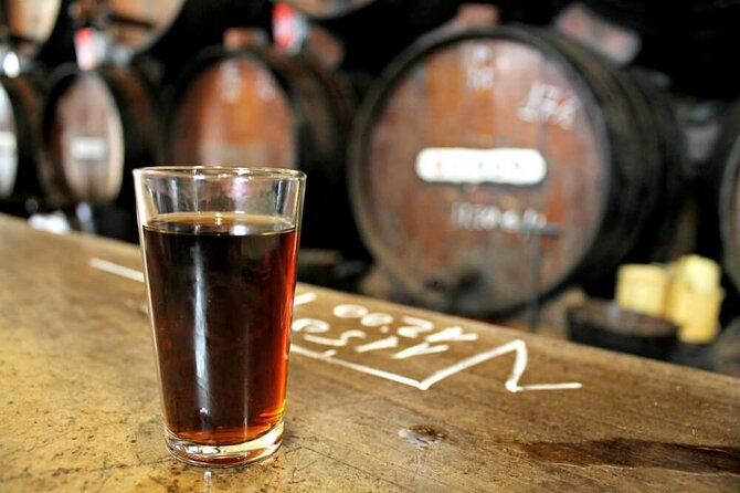 PREMIUM TAPAS TOUR: Tapas, Paella and Winery - Walking past Málaga’s old social center
