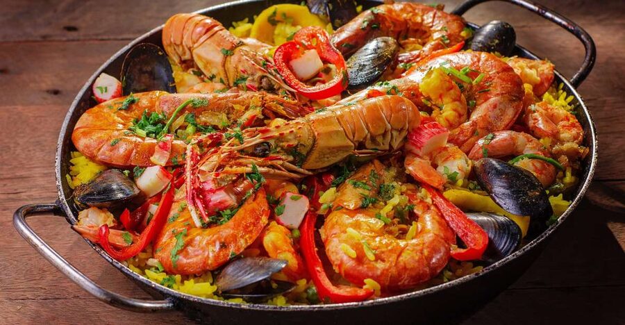Tapas Tour Paella and Malaga market with Official Guide - Walking from the market through central Malaga