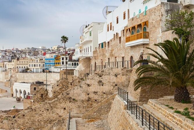 Vip Full Day Private Tangier Tour From Malaga All Inclusive - Moroccan lunch, mint tea, and a long table