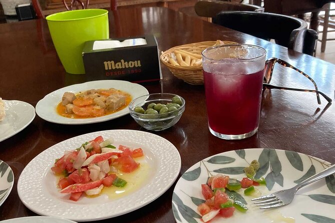 Wine and Tapas walking Tour in Malaga - The first bar: tapas with a local introduction